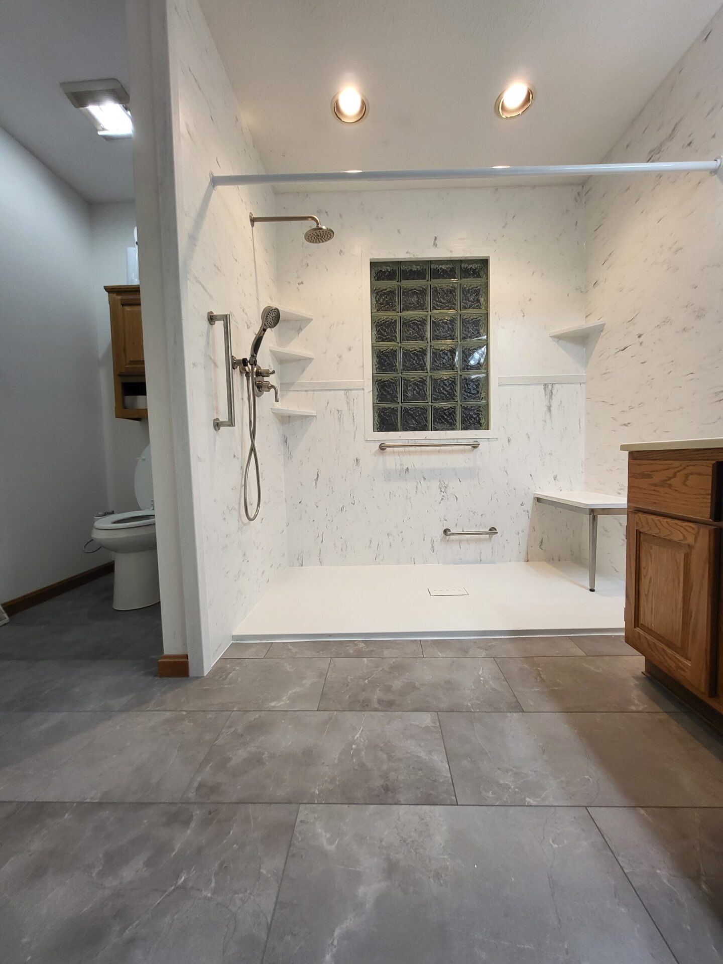 Large walk in shower with solid surface walls