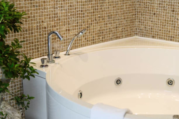 Bathroom remodeling contractor installing a new bathtub